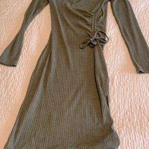 Green long sleeve slit front dress